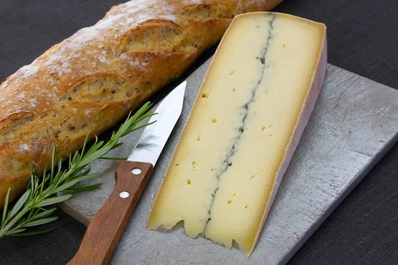Sample local cheeses in the Jura mountains