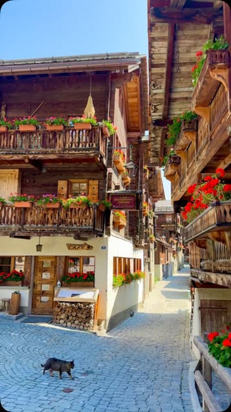 Grimentz, Switzerland – Balconies Full of Scarlet Geraniums