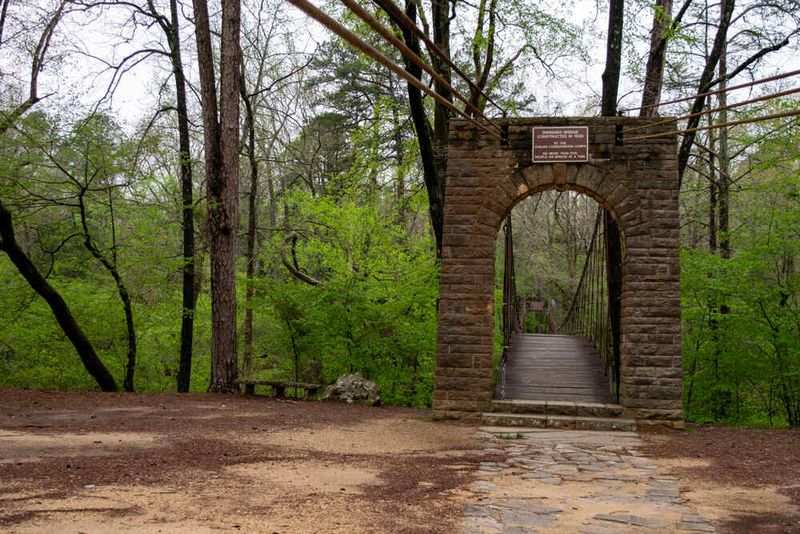Hike the Outcroppings Trail and cross the historic swinging bridge