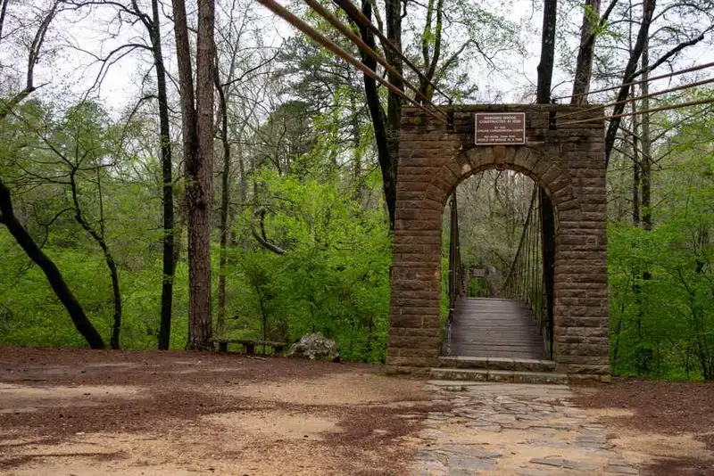 Hike the Outcroppings Trail and cross the historic swinging bridge