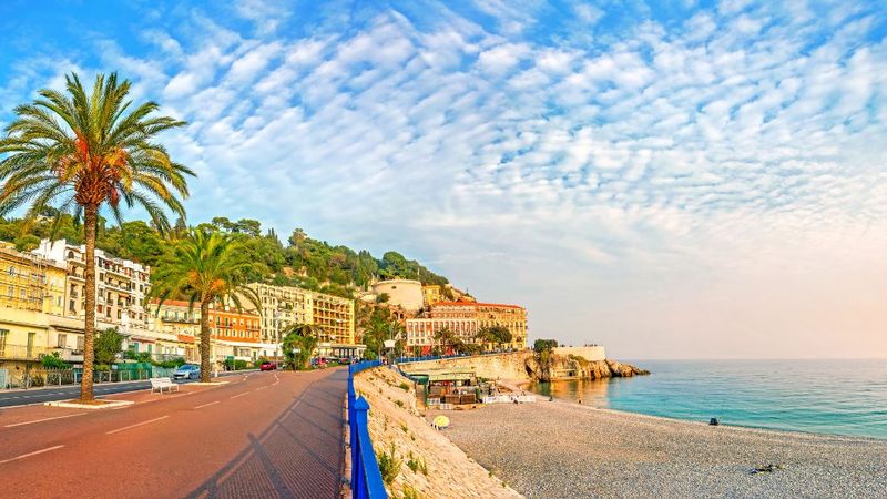 Walk the Promenade des Anglais at sunset
