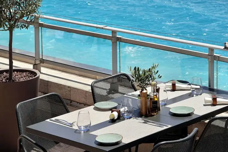 Watch the city light up from the rooftop bar at Le Méridien