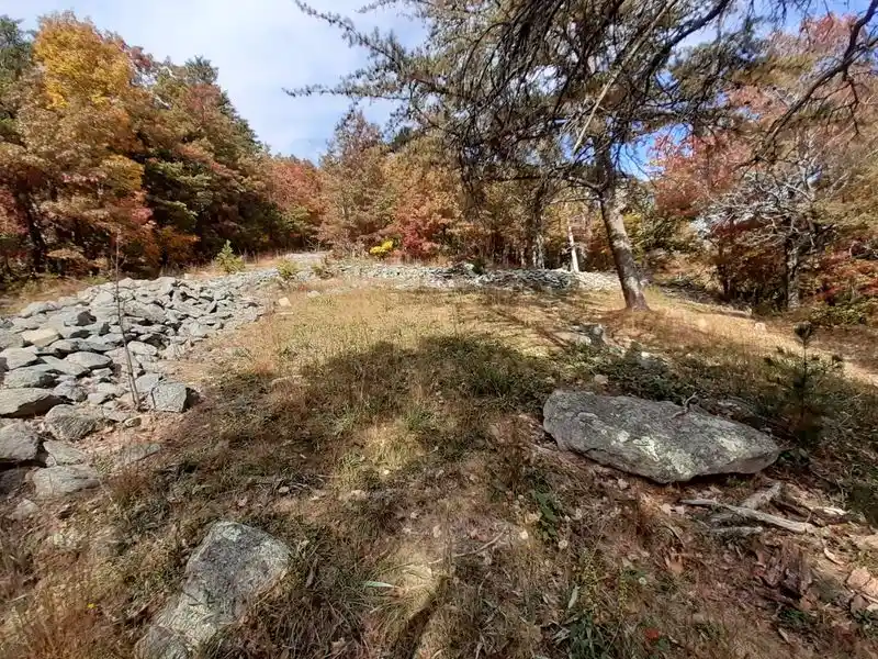 A Prehistoric Stone Enclosure with a Natural Venue