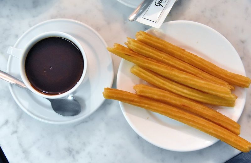Enjoy churros and chocolate at traditional cafés
