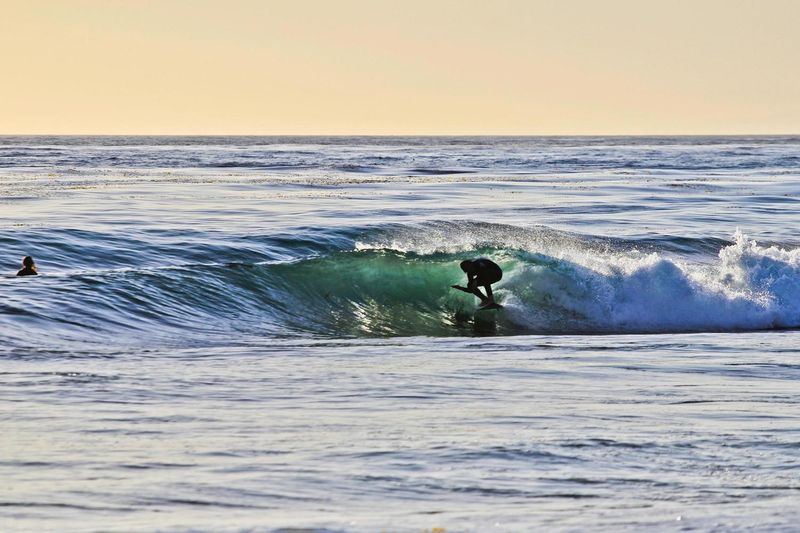 Surfing at Thalia Street Beach