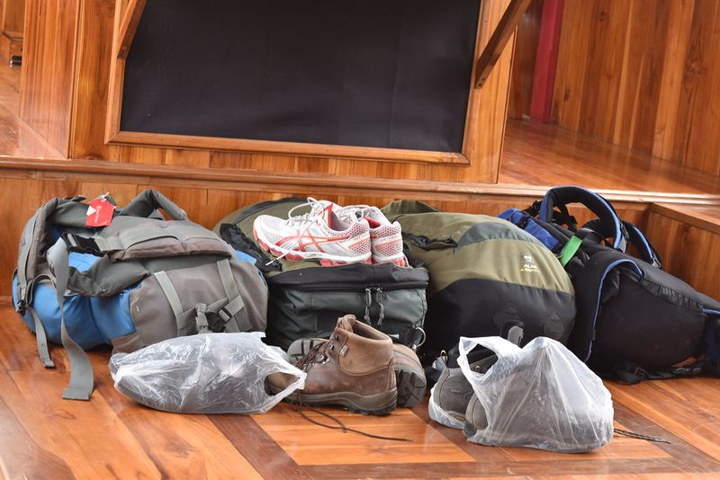 Assist with unpacking and stowing luggage efficiently