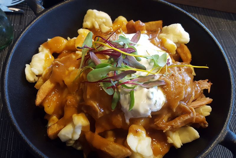 Savor Poutine at a Local Bistro