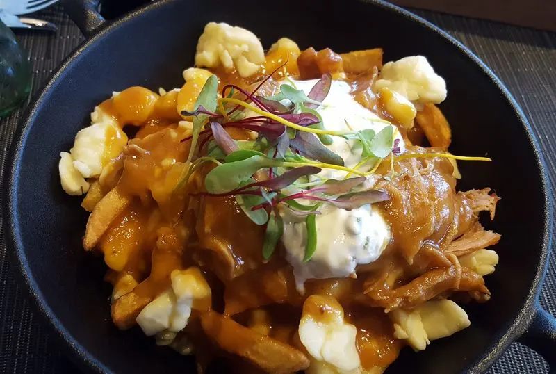 Savor Poutine at a Local Bistro