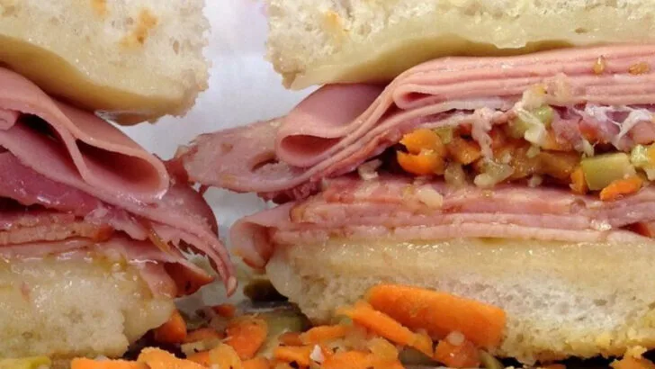 8 New Orleans Muffuletta Delis That Stack Italian Meats High On Sesame Seed Rounds