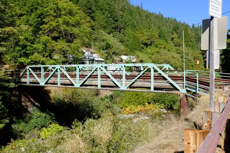 Cross the iconic suspension bridge over the river