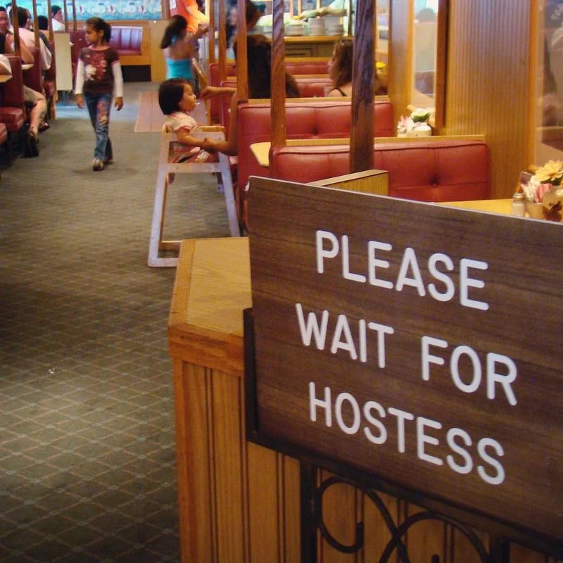 Wait to be seated by the host