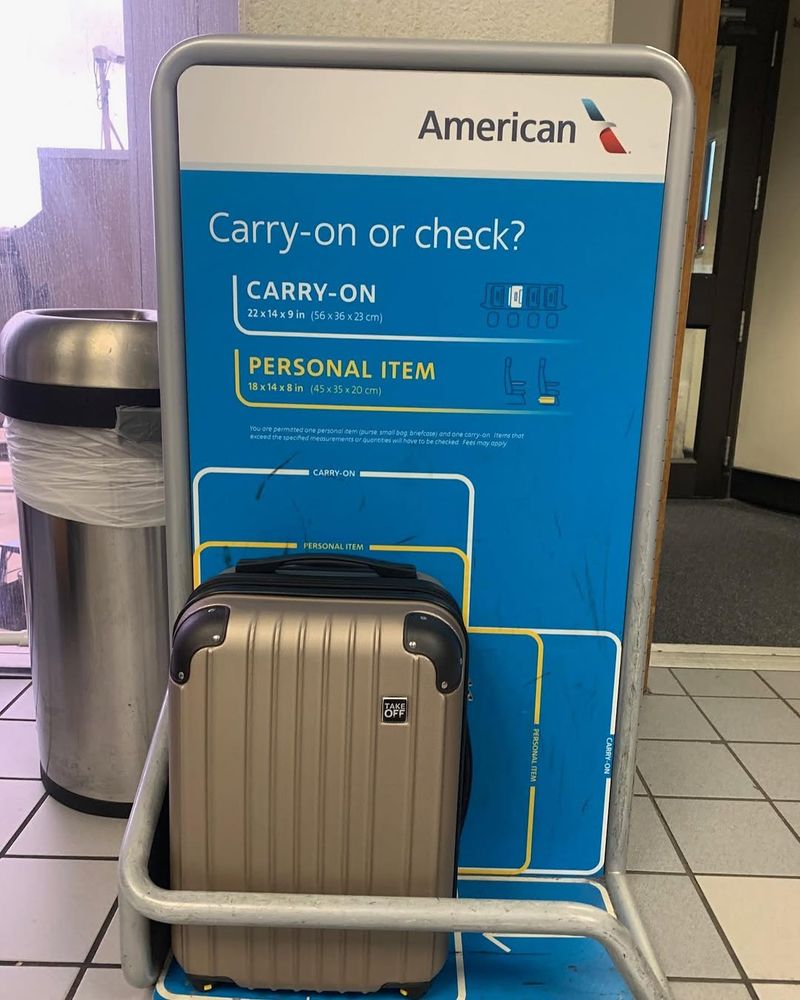 Dimensions include handles and wheels