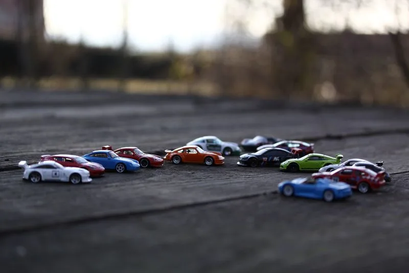 Miniature car models (BMW or Porsche)