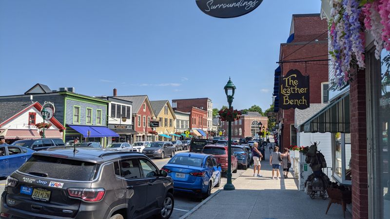 Main Street window displays, shopfront trees, and slow browsing