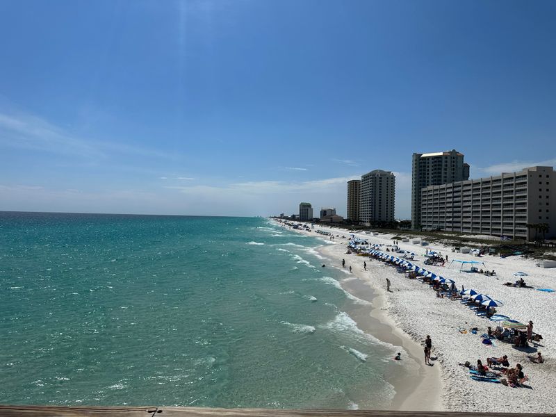 Family beach day setup on the sugar sand