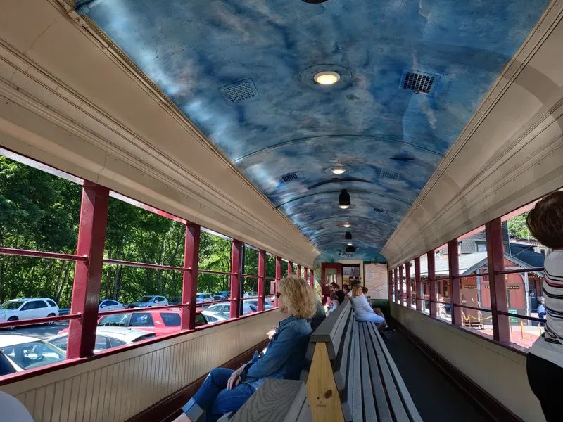 Open air versus enclosed coaches