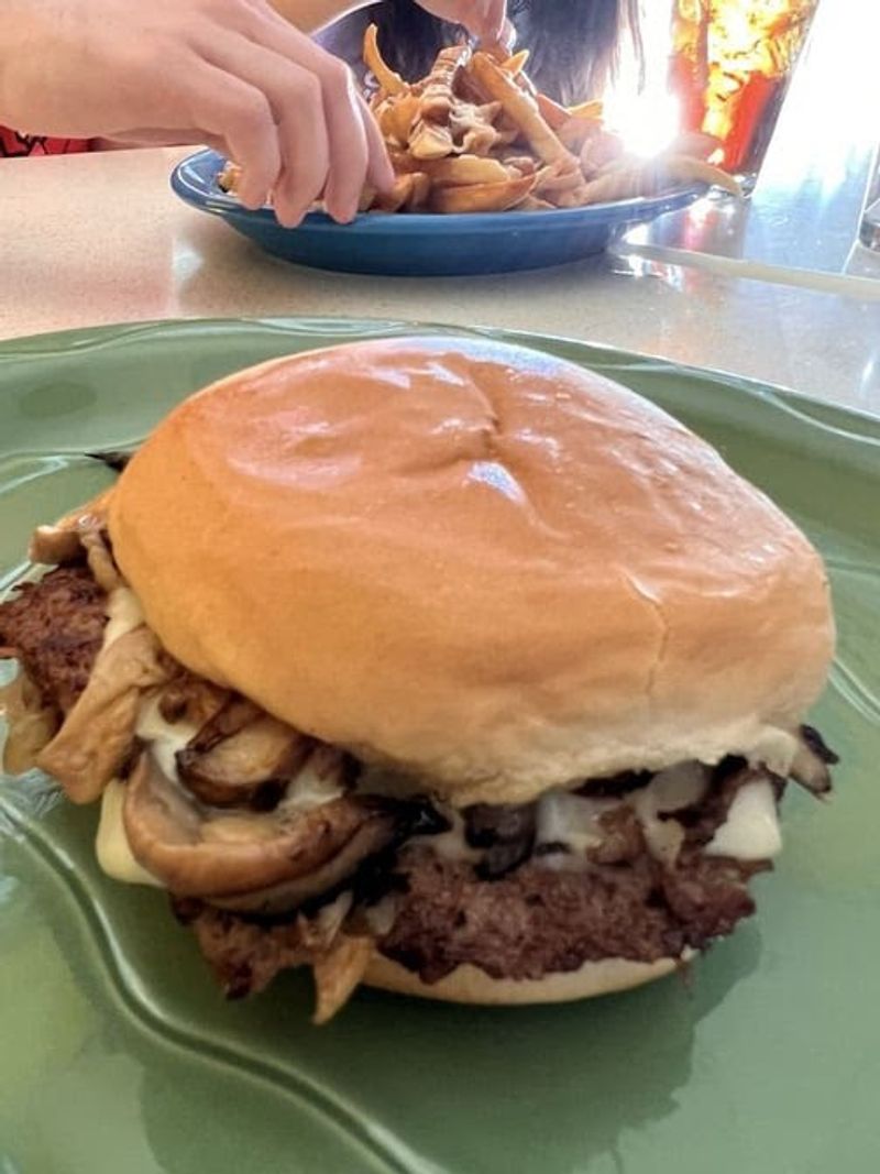 The signature burger: thin, crispy edged, onion kissed