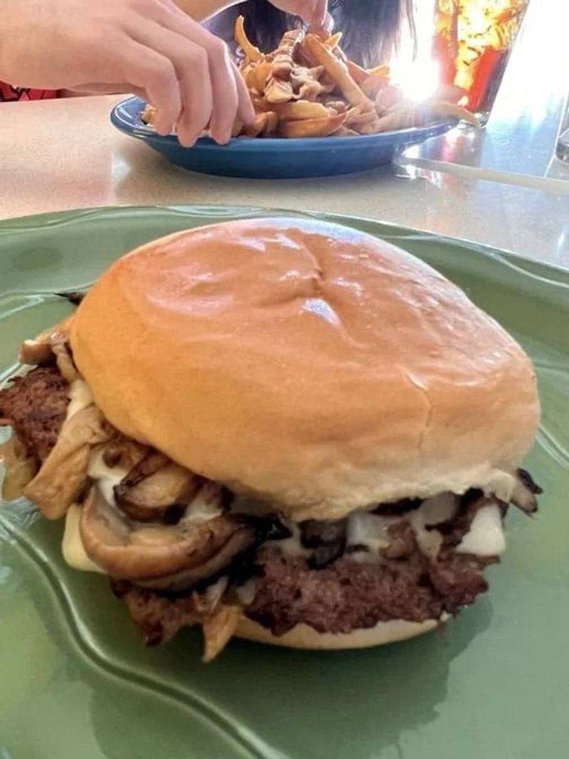 The signature burger: thin, crispy edged, onion kissed