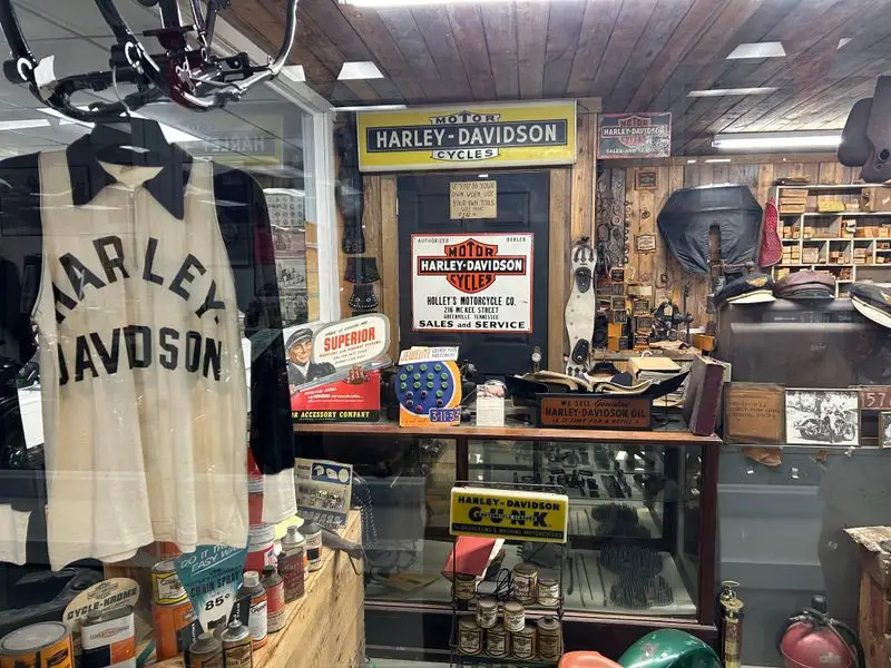 Memorabilia wall: posters, parts, and racing history