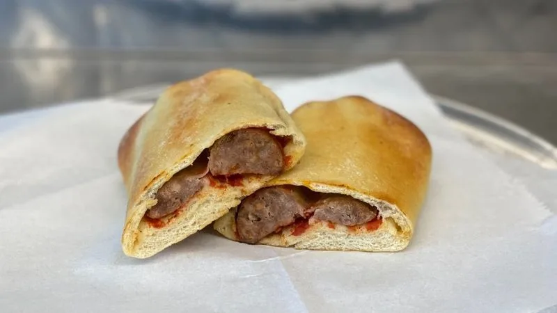 Spinach pies and sausage calzones