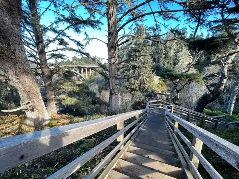 Descend the secure staircase to the cove beach