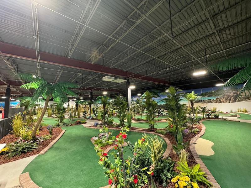 Putting on the Tropical Mini Golf Course