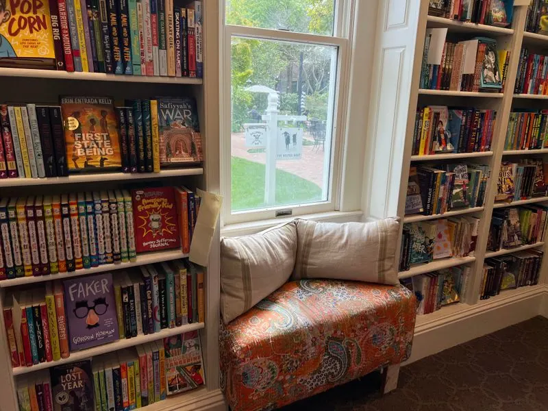 The cozy fireplace and reading chairs