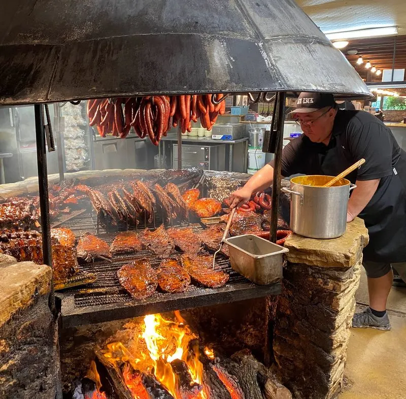 The Iconic Open BBQ Pit Greets You First