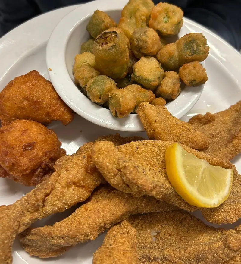 Sides that complete the plate: slaw, hush puppies, and rings