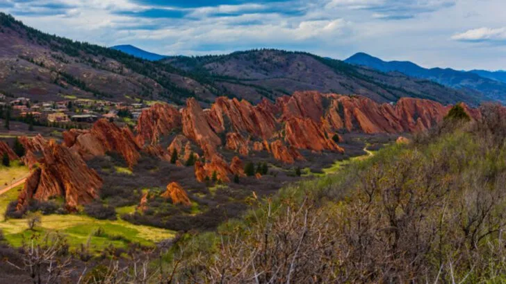 This Colorado state park feels almost unreal, with towering red rock walls rising straight from the plains