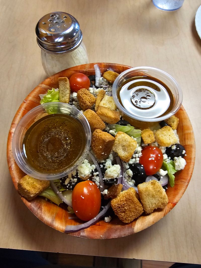 Menu variety beyond pizza: salads, sides, and drinks