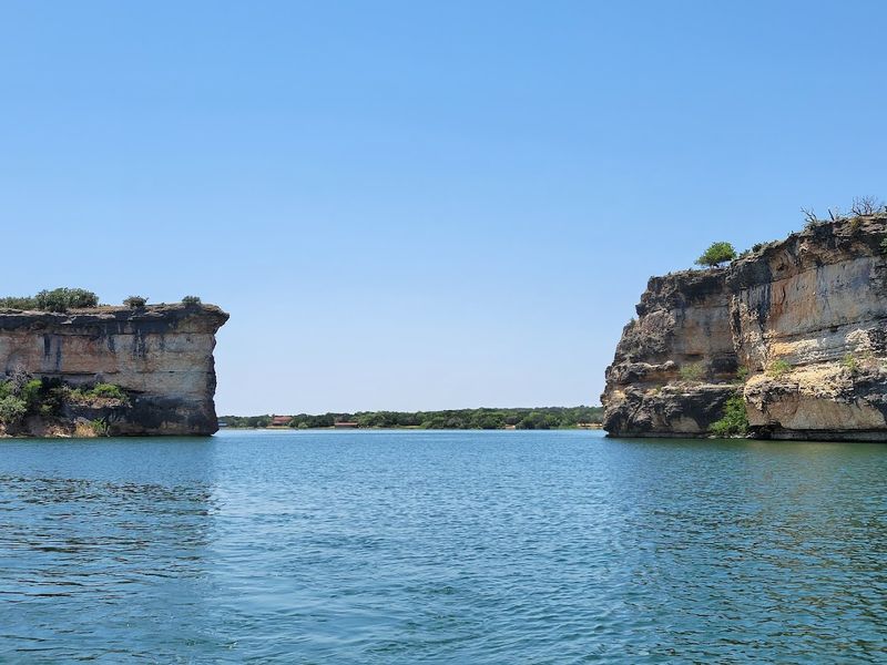 Sheer Limestone Cliffs That Frame the Lake