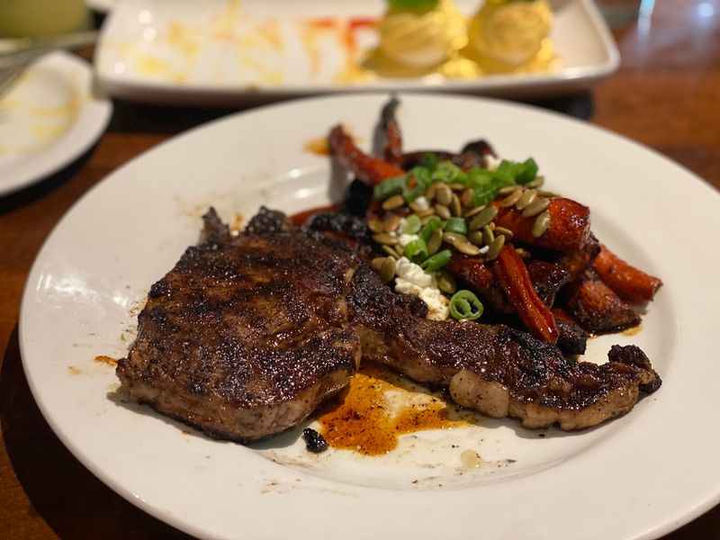 Hardwood-Grilled Steaks as the Restaurant's Signature
