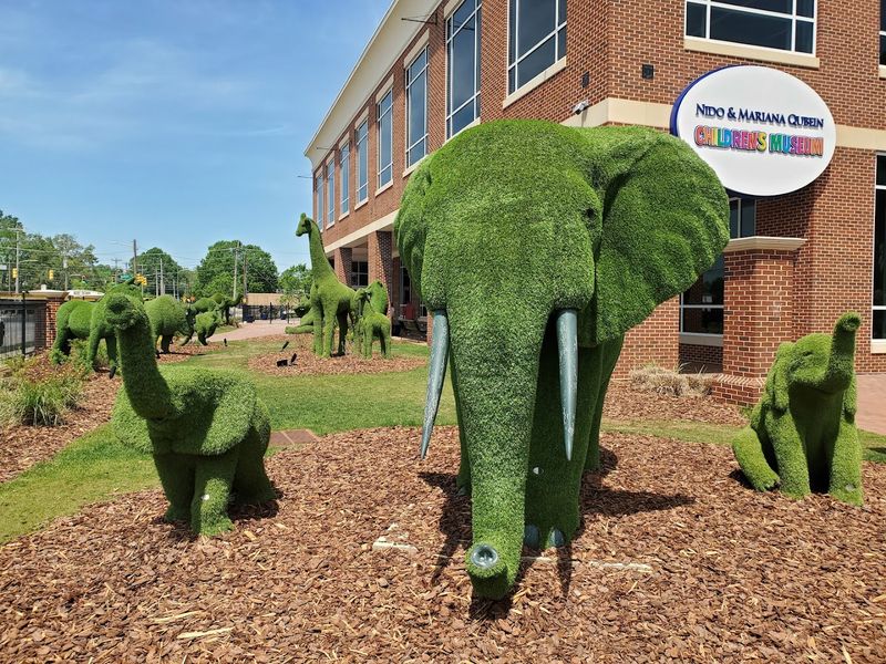 Outdoor Play Area With Giant Chess, Sandbox, and Topiary Animals