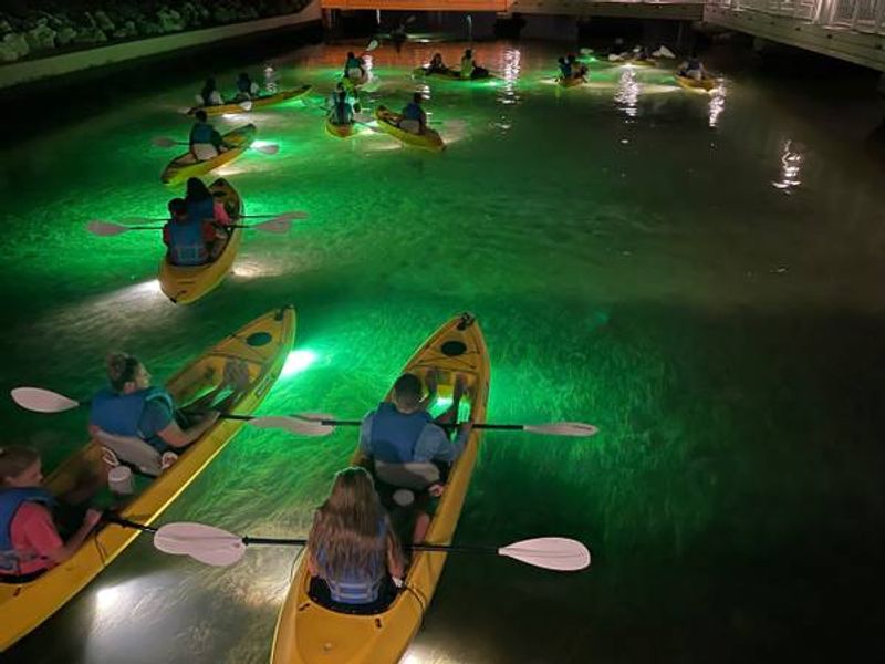 A Nighttime Kayak Tour Through Calm Coastal Waters