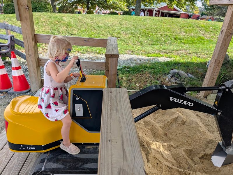 Construction Zone With Working Mini Excavators