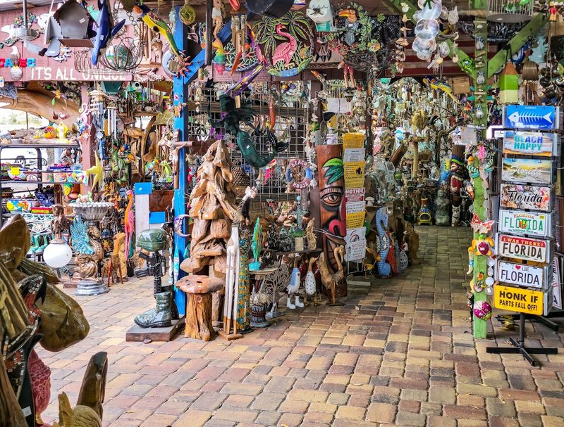 A Massive Collection of Colorful Metal Signs and Decorative Banners