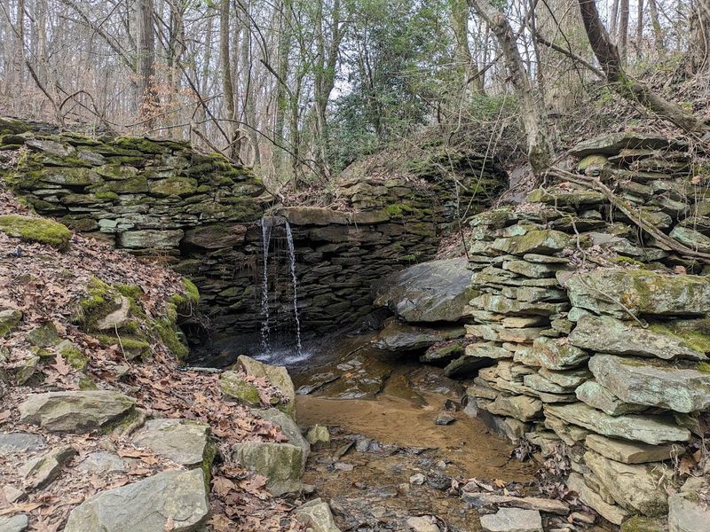 Layers Of Industry Along The Creek