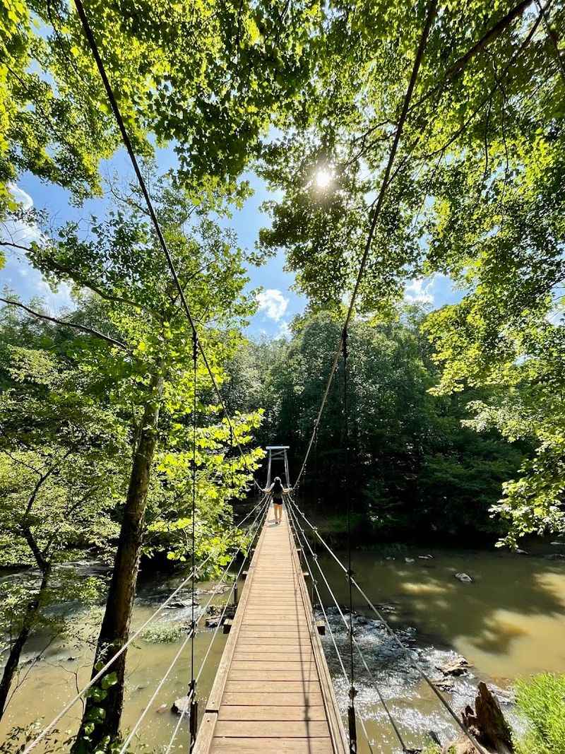 Historic Suspension Bridge Spanning The River