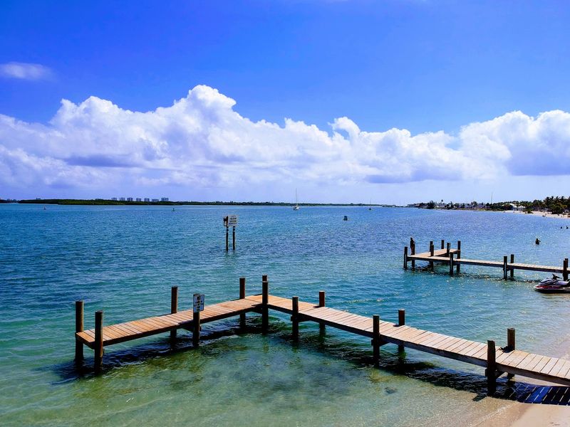 Calm Water Creates A Relaxed Shoreline Stroll