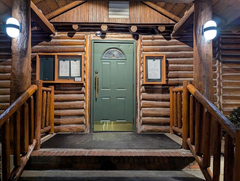 A Log Cabin Entrance With Serious Steakhouse Energy