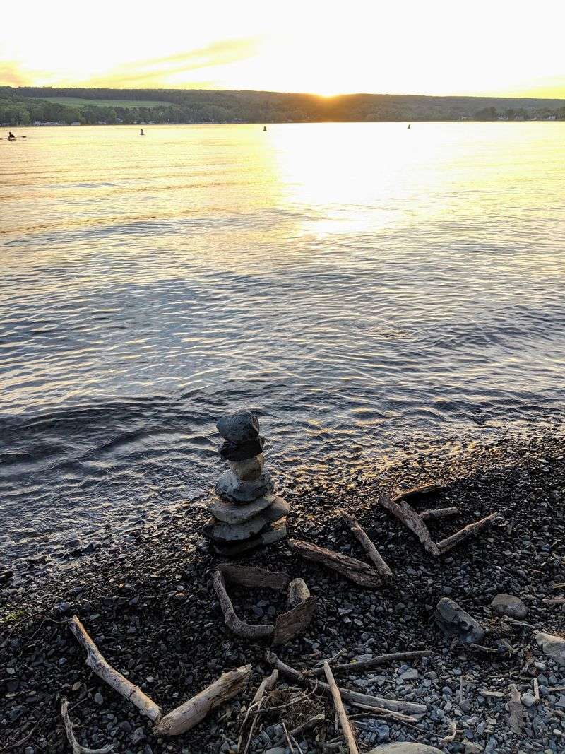 Rocky Beach Days With Water Shoes In The Bag