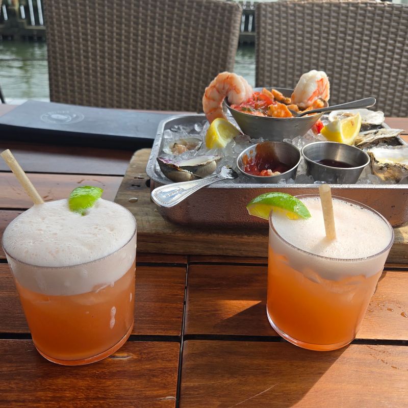 Cocktails at the Bar With Local Conversation Nearby