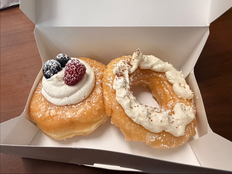 A full pastry case shines at Sara's Donut Story in Flower Mound