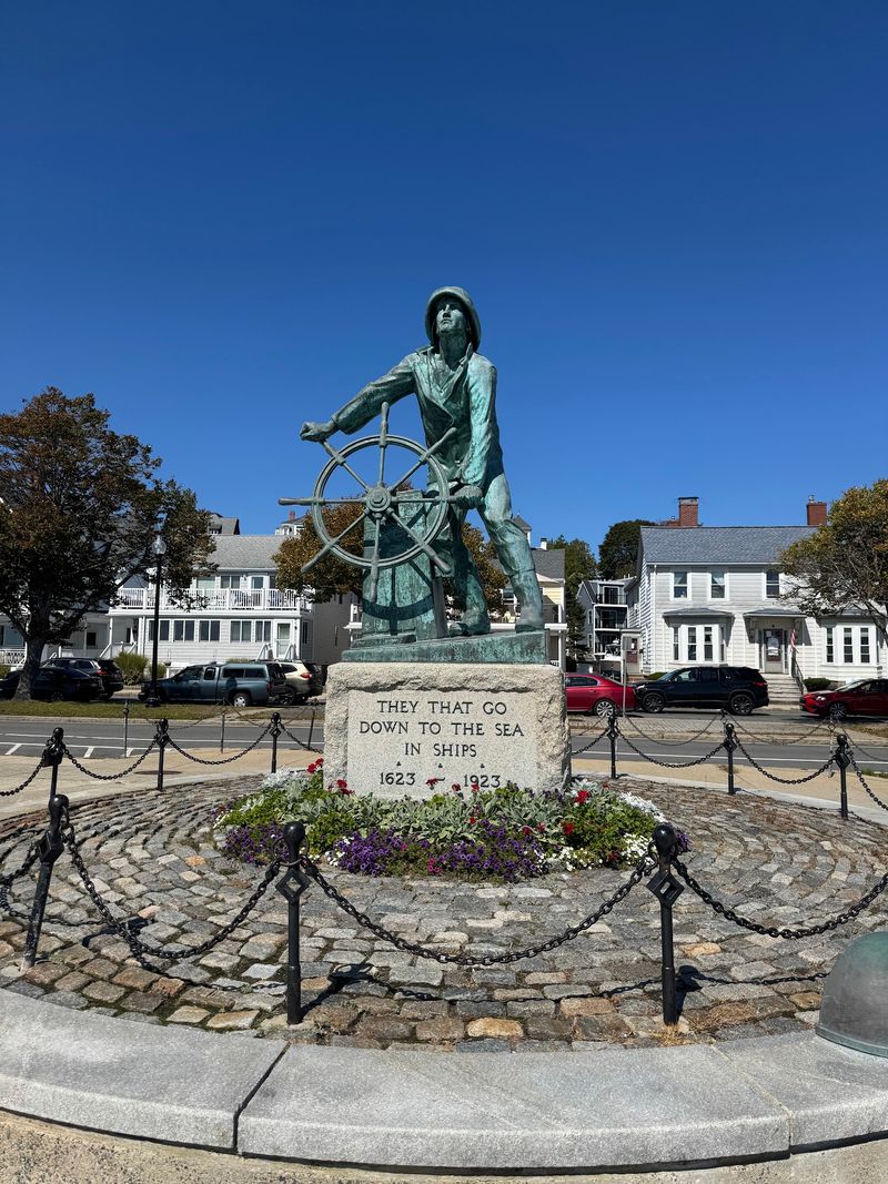 The Bronze Fisherman Standing Watch Over the Harbor