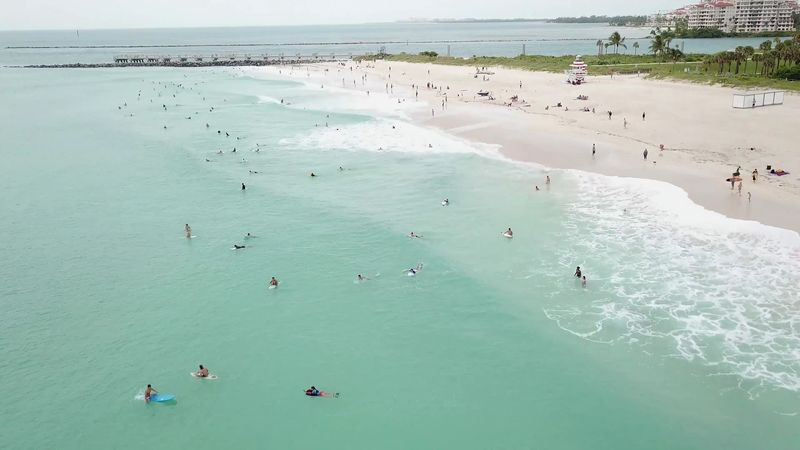 At the city edge, the ocean moves differently - South Pointe Park Beach