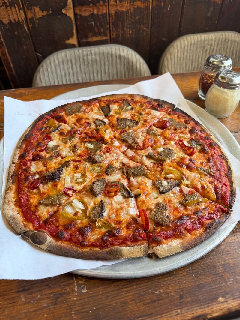 The Pizza Is Thin, Crispy, and Packed With Old-School Character
