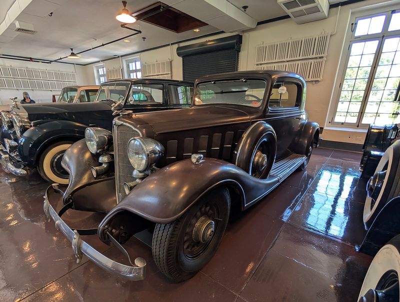 Classic Cars Behind the Grandeur