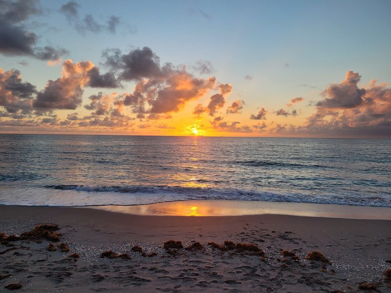 Sunrise Turns The Pier Into A Quiet Theater