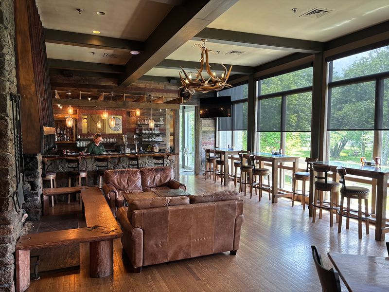 A lakeside table beneath Sharp Top Mountain